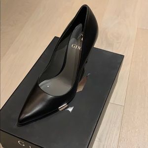 Black stilettos with Swarovski heel detail.